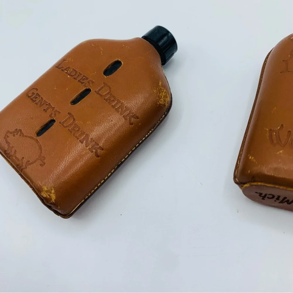 Pair Of Vintage Souvenir Leather Wrapped Glass Whiskey Flasks